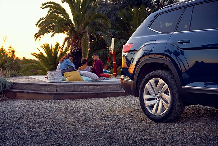 Family camping near a car