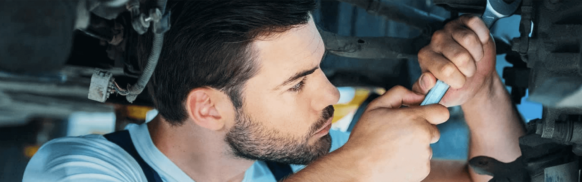 Service Center Certified Technician Working On A Vehicle